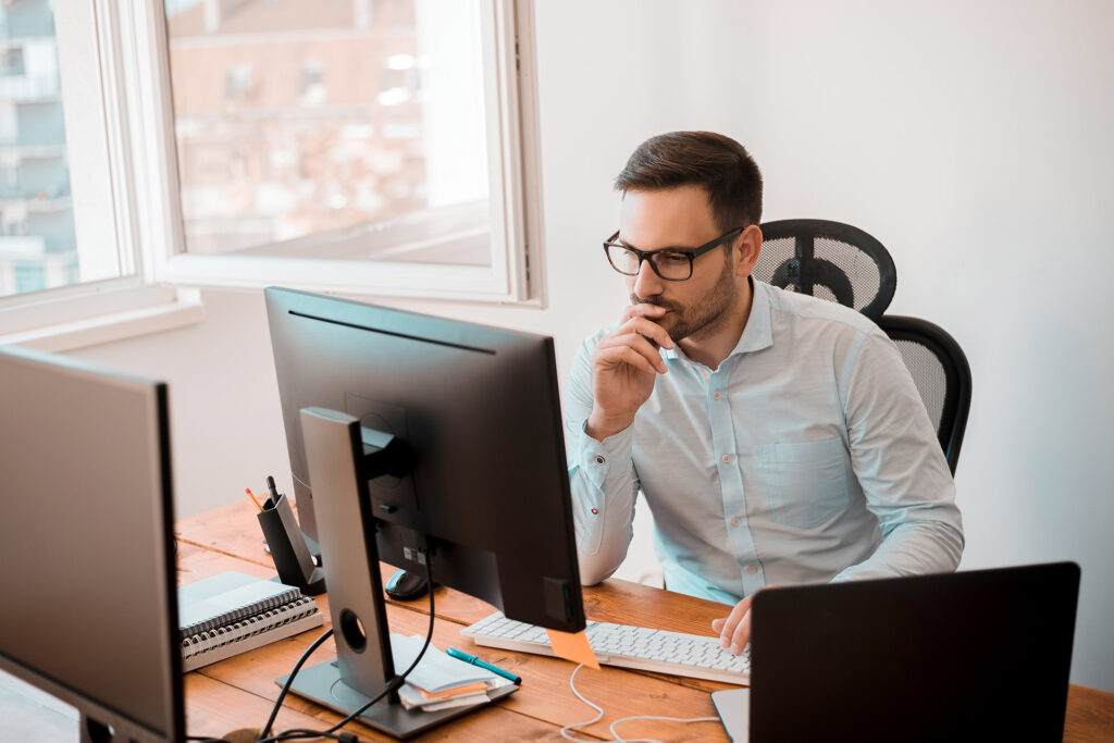 IT consultant working on a project at his desk in New Jersey