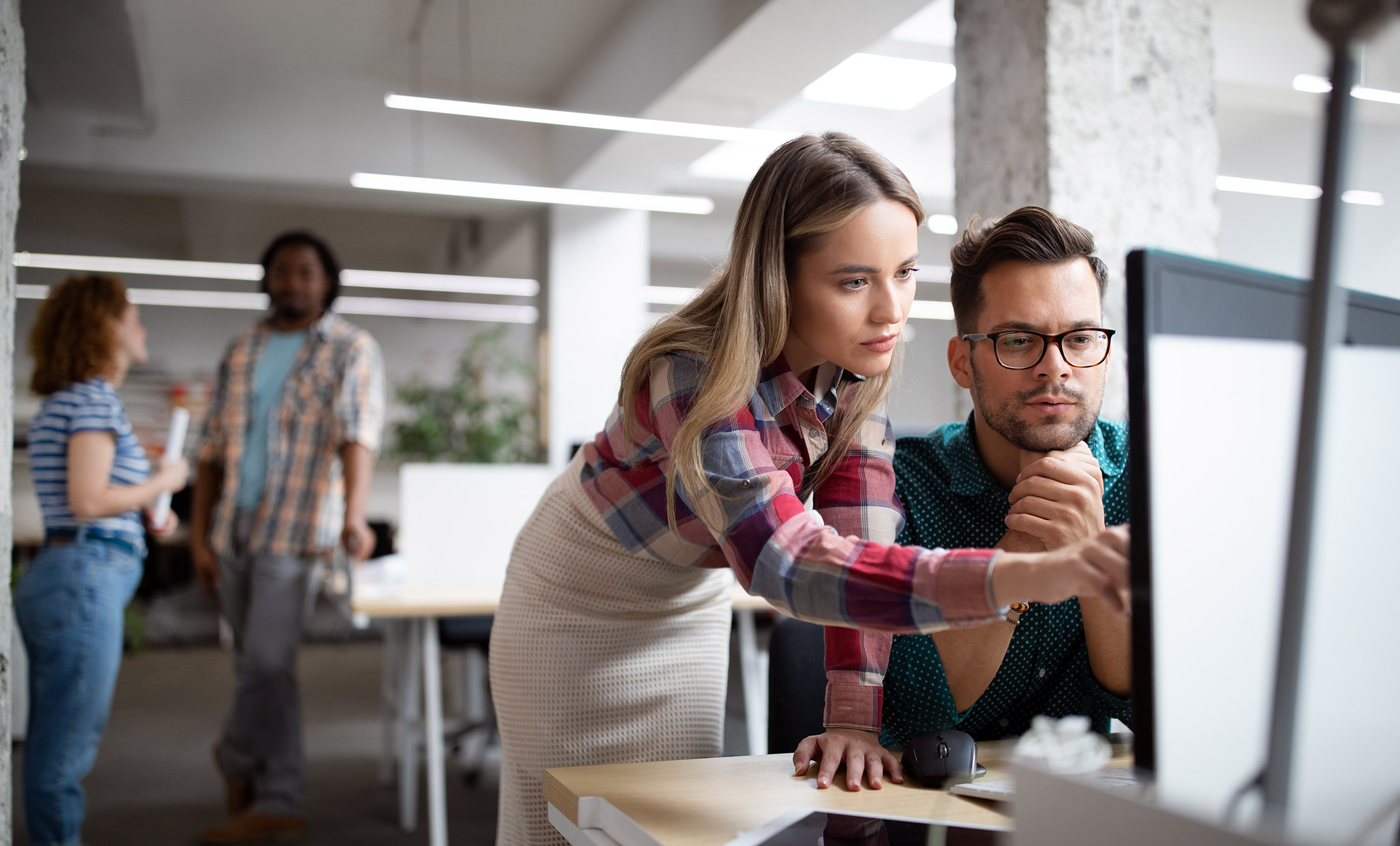 IT consultants working together on a client project