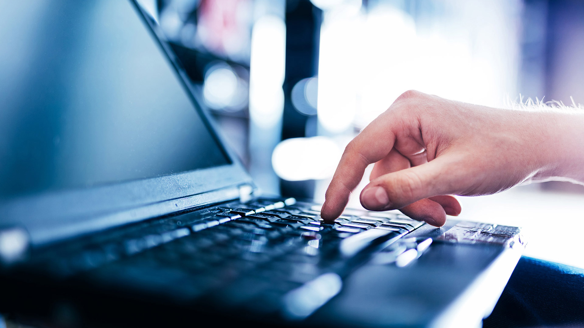 IT specialist typing on a computer