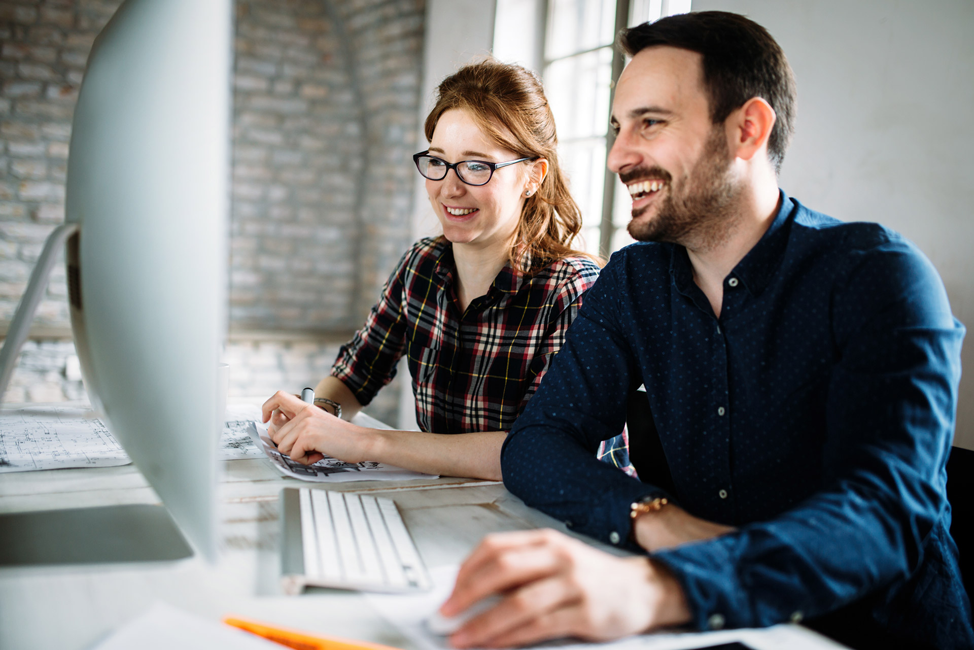 two IT employees working together