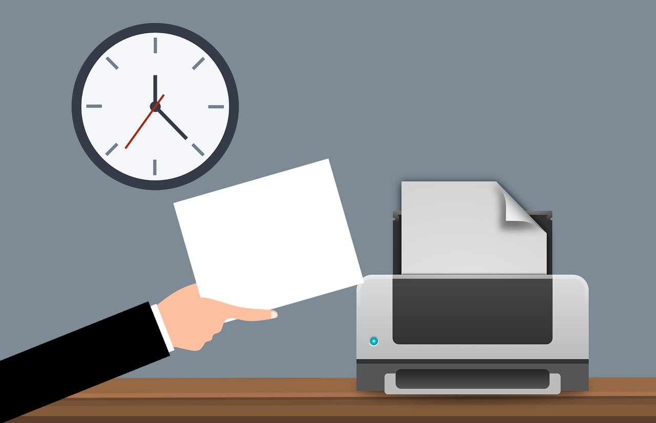 Have You Tried Microsoft Universal Print? (Learn What It Can Do for You) 2 Office worker collecting documents using Microsoft Universal Print