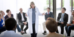 Doctor meeting with a team to discuss healthcare compliance