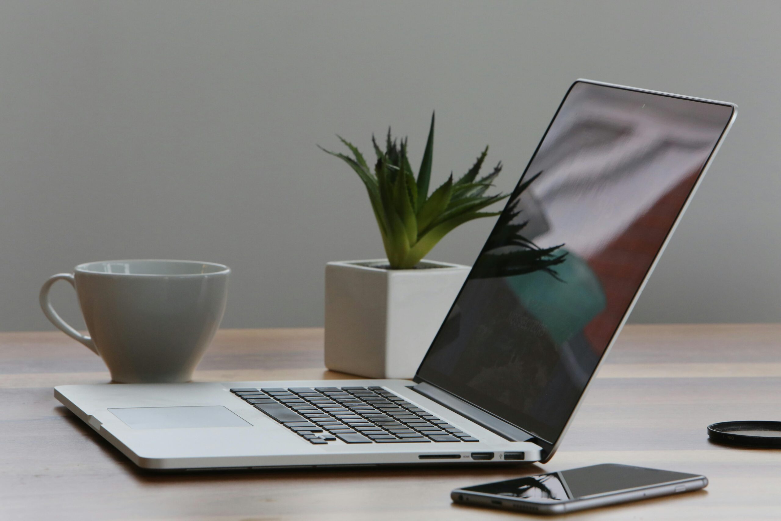 7 Ways Using AI for Work Can Get Complicated 2 Professional using AI for work at a modern office desk