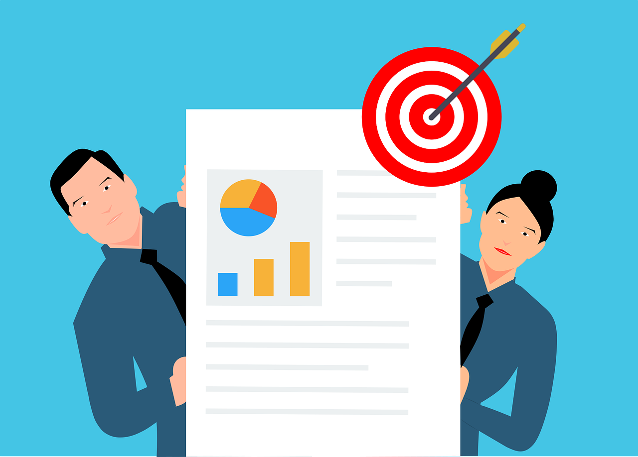 10 Knowledge Management Strategies That Will Unlock Your Team's Brainpower 2 Team collaborating on knowledge management strategies around a shared hub