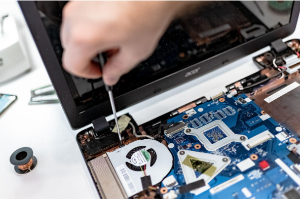 How Long Business Computers Last (and When to Safely Replace Them) 1 computer being repaired