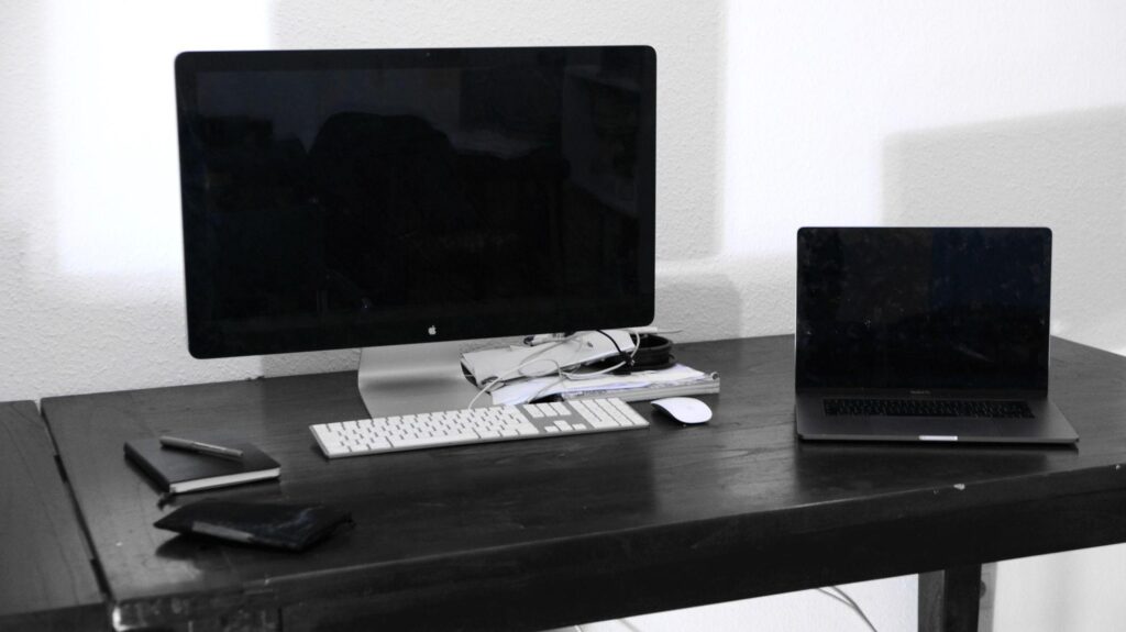 How Long Business Computers Last (and When to Safely Replace Them) 2 How long business computers last — a laptop and desktop workstation in a New Jersey office reaching the three-year review point