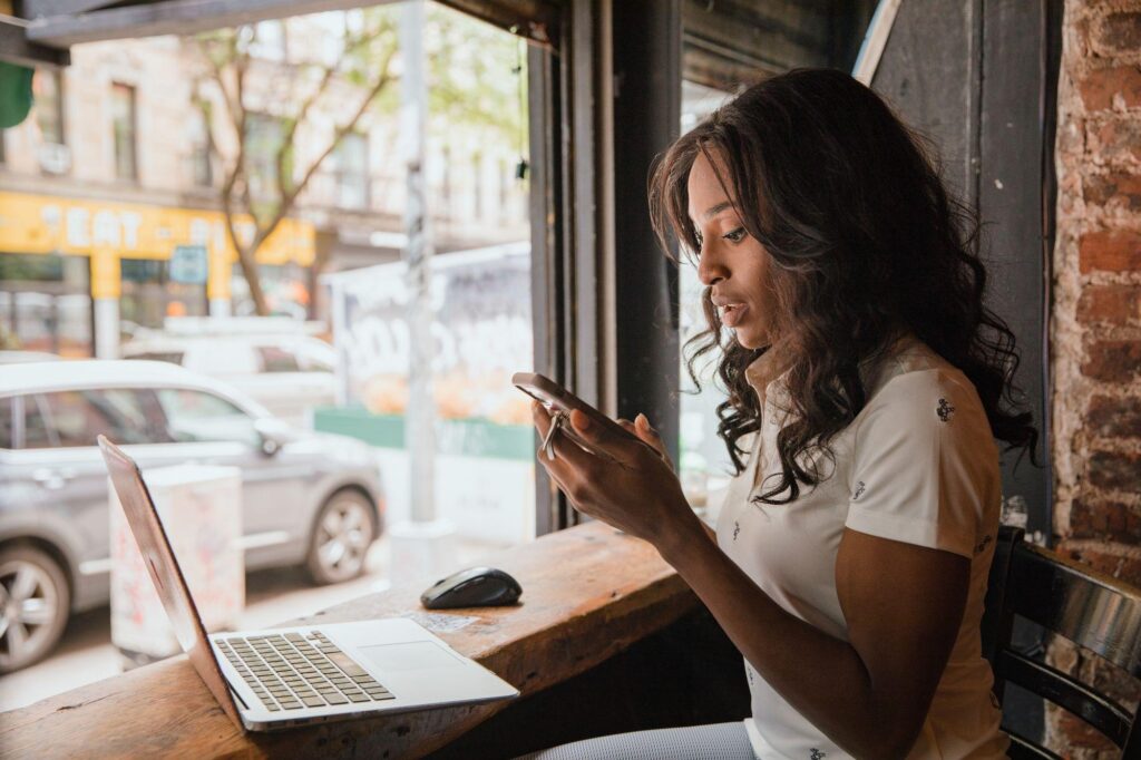 Should Employees Use Personal Devices for Work? The Hidden Risks for NJ Businesses 2 Should employees use personal devices for work - employee checking company email on a personal phone