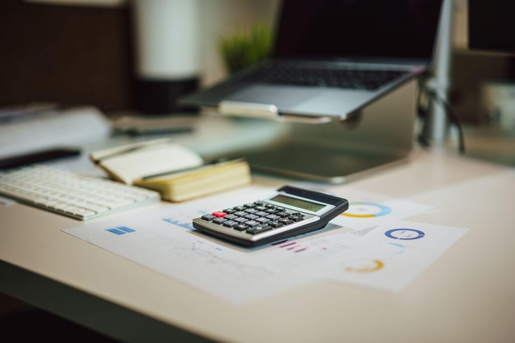 Small Business IT Budget Checklist: What to Include and How to Plan It 5 Business owner and finance manager working through a small business IT budget checklist step by step